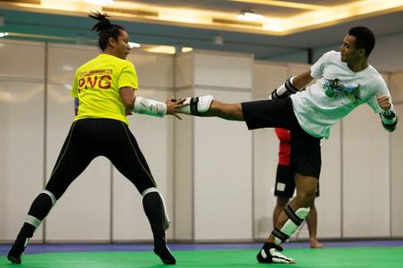 Maxemillion executing a side kick to Samantha during training in Rio. PHOTO: J. Pini/ Team PNG.