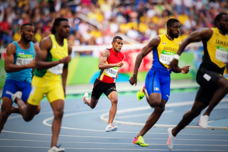 BIG FIELD: Theo Piniau pressing up to his field of competitors in the men's 200m heat. PHOTO: J. Pini/ Team PNG.
