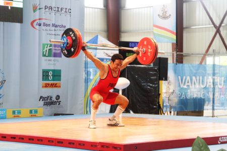 Morea Baru using his leges to power up the lift in the snatch competition.