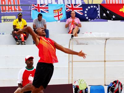 PNG's Moha Mea and Richard Kilarupa taking on Solomon Islands in their first match of the tournament.