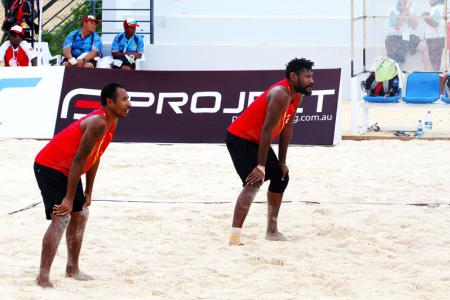 PNG's Moha Mea and Richard Kilarupa taking on Solomon Islands in their first match of the tournament.