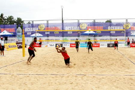 PNG's Moha Mea and Richard Kilarupa taking on Solomon Islands in their first match of the tournament.