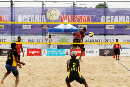 PNG's Moha Mea and Richard Kilarupa taking on Solomon Islands in their first match of the tournament.