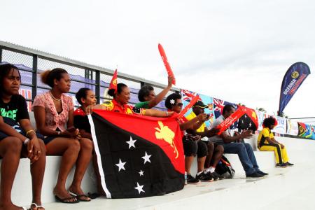 PNG's Moha Mea and Richard Kilarupa taking on Solomon Islands in their first match of the tournament.